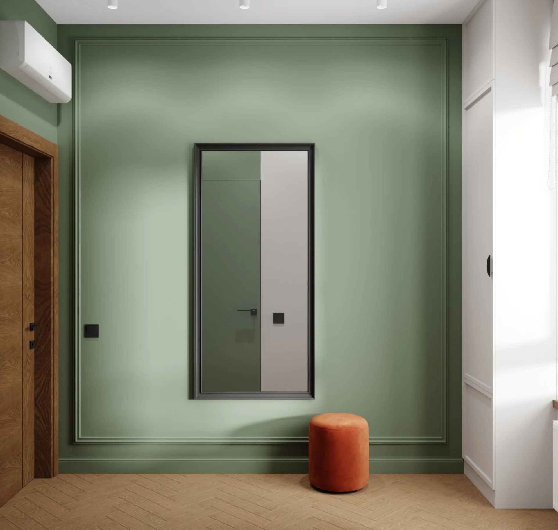Entrance with a graphite-framed mirror, terracotta ottoman and oak door